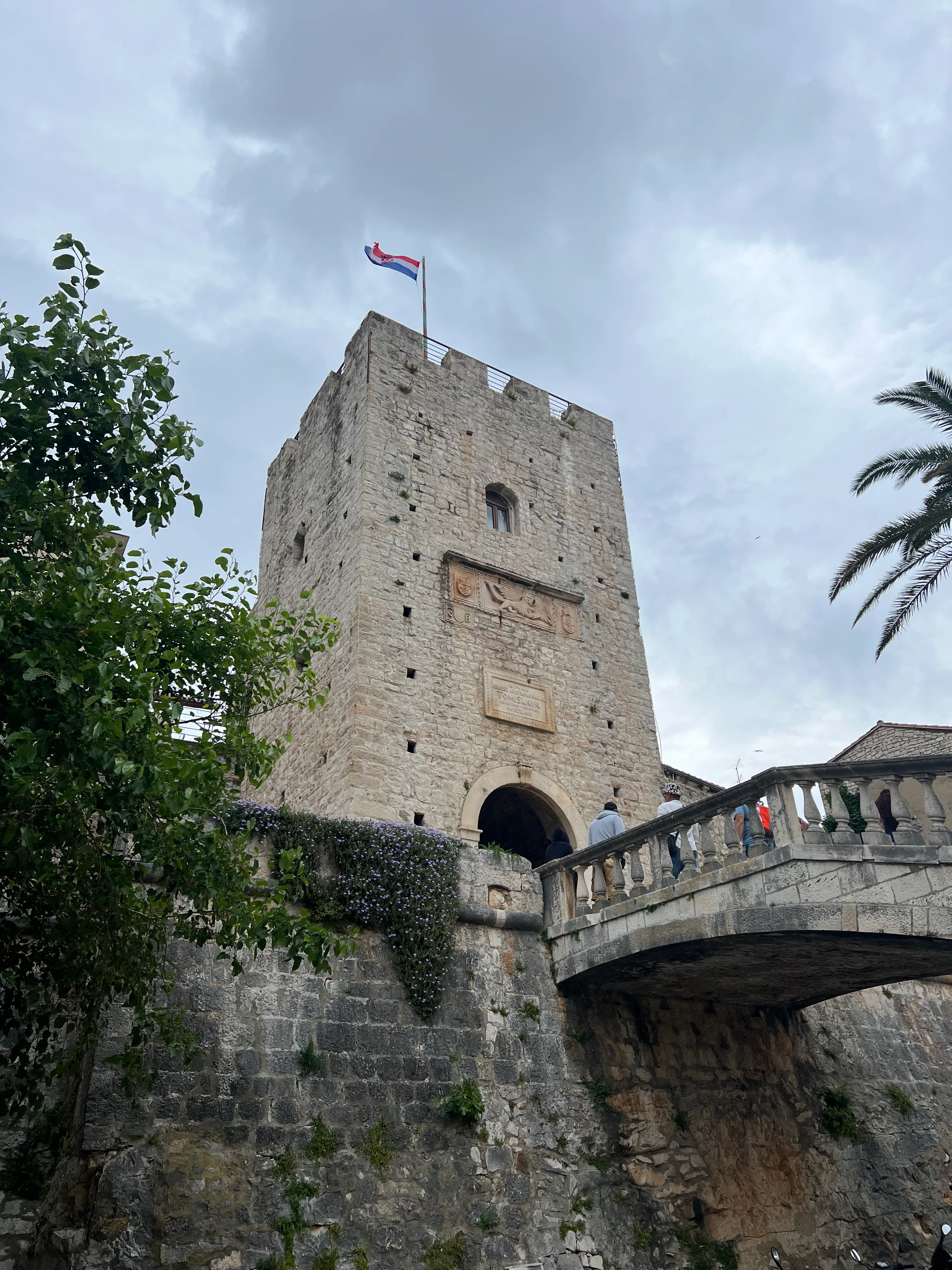 Revelin Tower with Croatian flag in KorcÌula old town, Croatia.jpg